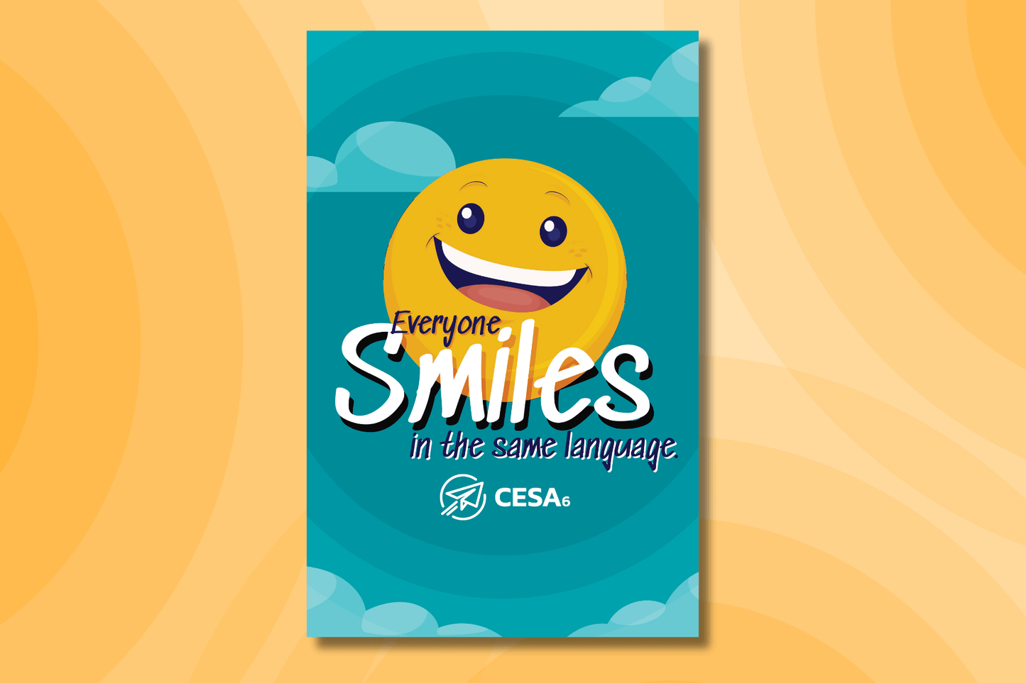 A cheerful yellow smiley face is centered against a teal sky with clouds, creating a bright and uplifting design. The text reads, “Everyone Smiles in the Same Language,” with the CESA 6 logo at the bottom.