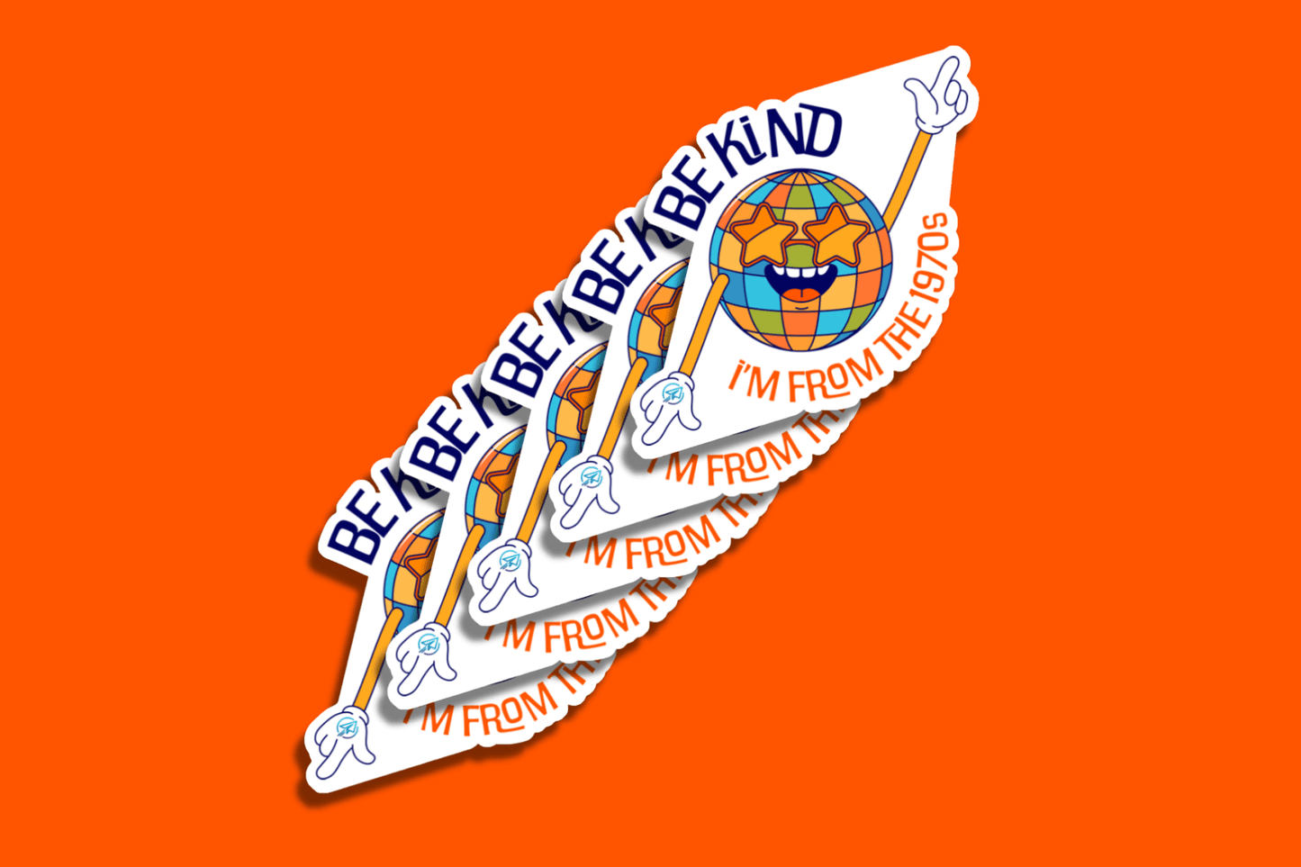A stack of vibrant vinyl stickers featuring a cheerful disco ball character with star-shaped sunglasses and white gloves, dancing with both arms. The character is set above the words “I’m from the 1970s” in curved orange text. Above the figure is the phrase “Be Kind” repeated in blue. The background is solid orange.