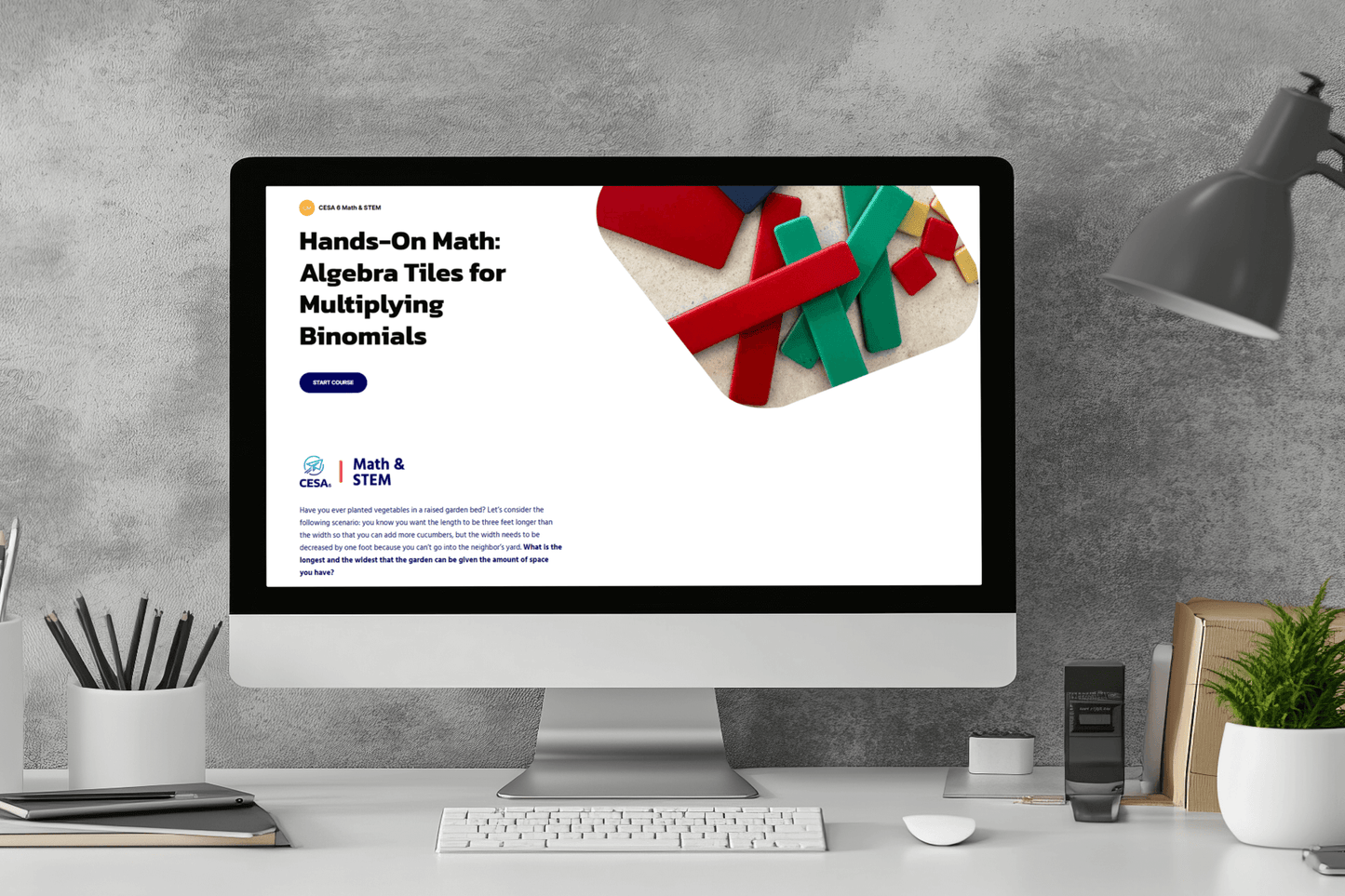 A computer screen on a desk displays a webpage titled "Hands-On Math: Algebra Tiles for Multiplying Binomials." The page shows colorful algebra tiles. A potted plant, lamp, and stationery are nearby, creating a studious atmosphere.