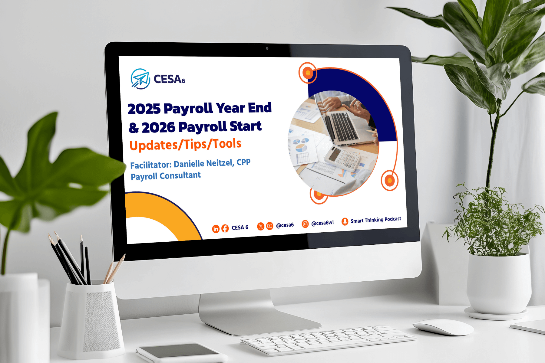 A computer screen displays a presentation titled "2025 Payroll Year End & 2026 Payroll Start: Updates/Tips/Tools," with charts and a laptop image. The setting includes a plant, pens, and a clean desk, conveying a professional atmosphere.