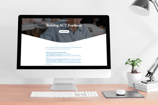 A modern desktop display shows a webpage titled "Building ACT Readiness." The workspace is neatly organized with a lamp, plant, and keyboard on a wooden desk, conveying a calm and studious atmosphere.