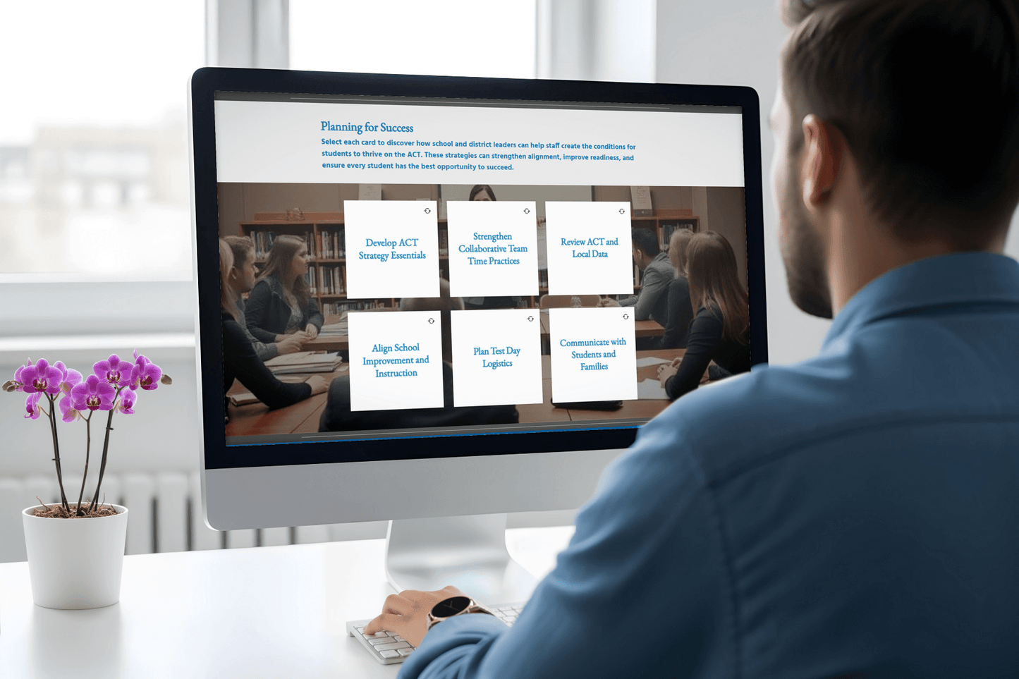 A man in a blue shirt looks at a computer screen displaying an educational planning site. The screen features six option cards on ACT strategies. A purple orchid adds decor to the desk.