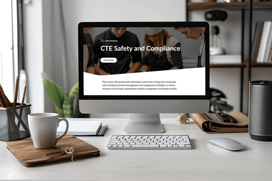 Desktop computer displays a “CTE Safety and Compliance” course page in a bright office, with keyboard, coffee mug, books, and plants.