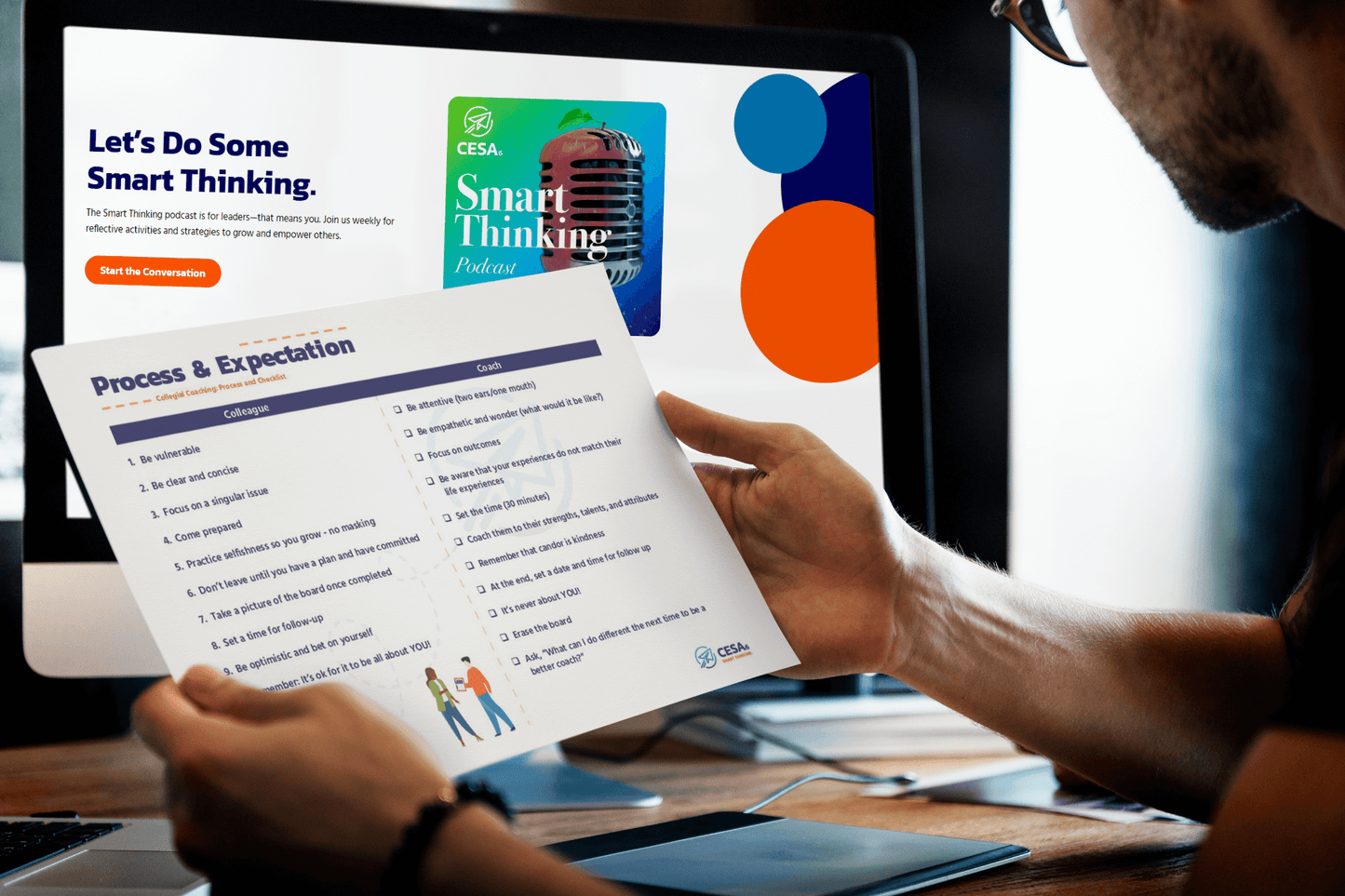 A person holds a "Process & Expectation" checklist for coaching, with the CESA6 Smart Thinking podcast visible on the screen in the background. The checklist includes guidelines for both the colleague and coach.