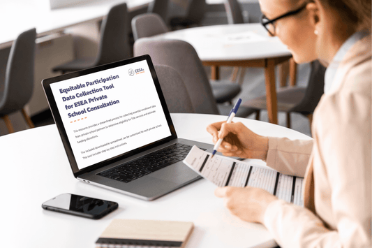 A professional seated at a table, reviewing a document with a pen while using a laptop. The laptop screen displays a title that reads, 'Equitable Participation Data Collection Tool for ESEA Private School Consultation.