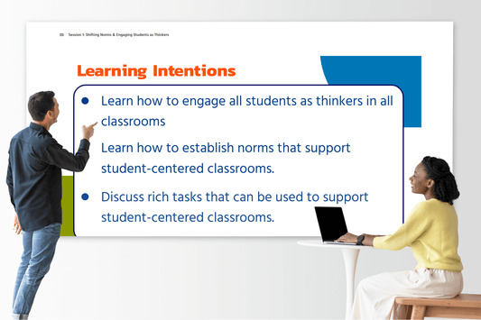 Two educators are interacting with a large projected slide titled “Learning Intentions.” The slide outlines three goals: engaging all students as thinkers, establishing student-centered norms, and discussing rich tasks that promote student-centered classrooms. The educator on the left is pointing toward the slide, while the educator on the right, seated at a table with a laptop, smiles and looks engaged.