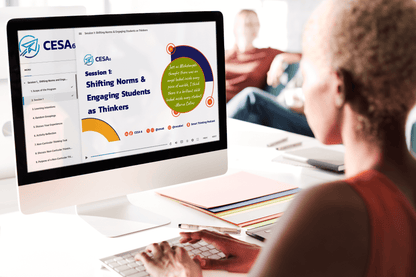 An educator is seated at a desk engaging with a professional learning module on a desktop computer. The screen displays a session titled “Shifting Norms & Engaging Students as Thinkers” from CESA 6, including a quote by Marva Collins. The desktop interface shows a structured learning menu with modules, and colorful folders and pens are organized nearby.