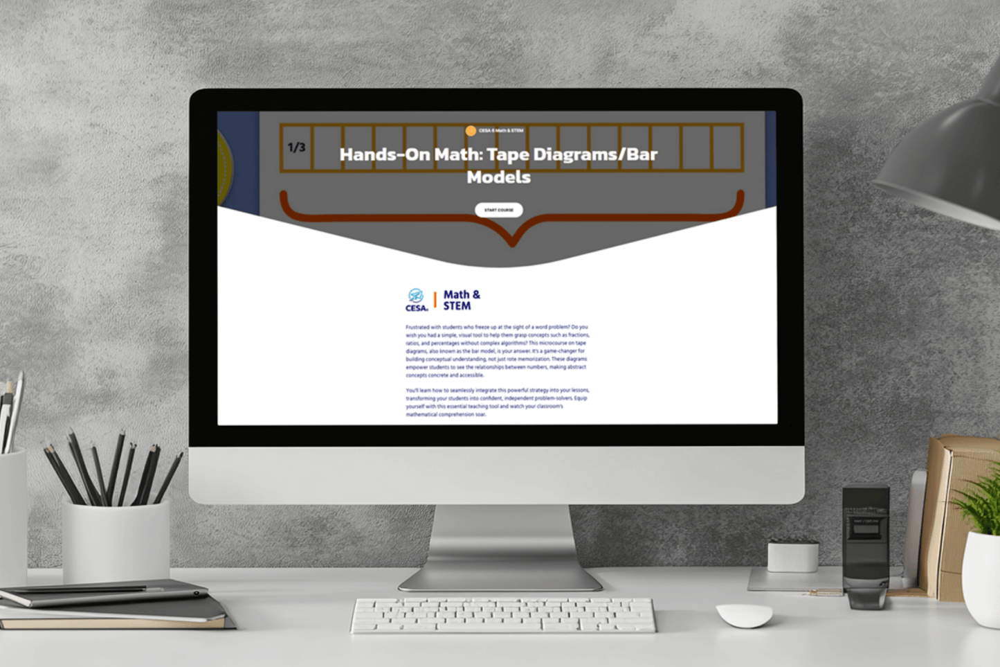 A computer screen on a desk displays an educational webpage titled "Hands-On Math: Tape Diagrams/Bar Models." The minimalist workspace includes a lamp, plant, and stationery, conveying a focused and organized atmosphere.