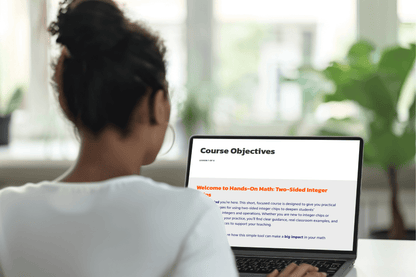 A person with a bun is using a laptop in a bright room. The screen displays a section titled "Course Objectives" for a math course. The scene is focused and studious.
