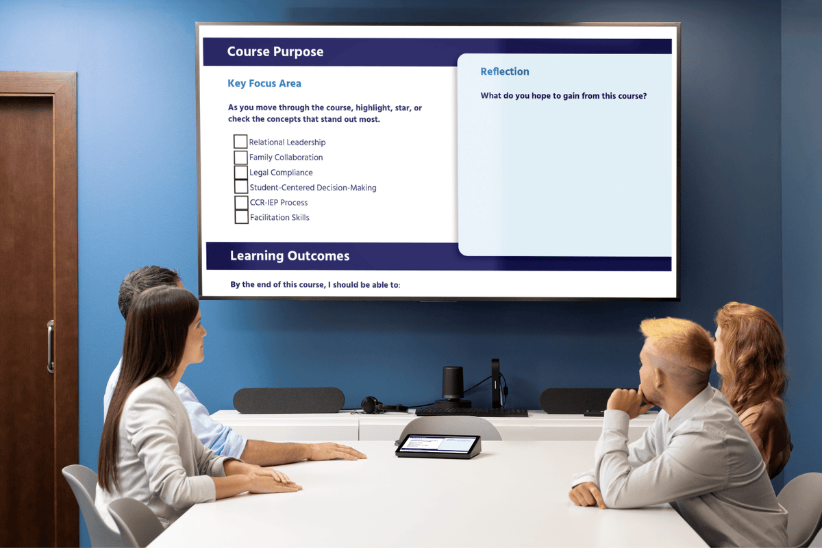 Three colleagues attend a modern training session, viewing a projected course-purpose slide with reflection prompts and learning outcomes.