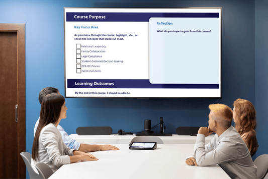 Three colleagues attend a modern training session, viewing a projected course-purpose slide with reflection prompts and learning outcomes.