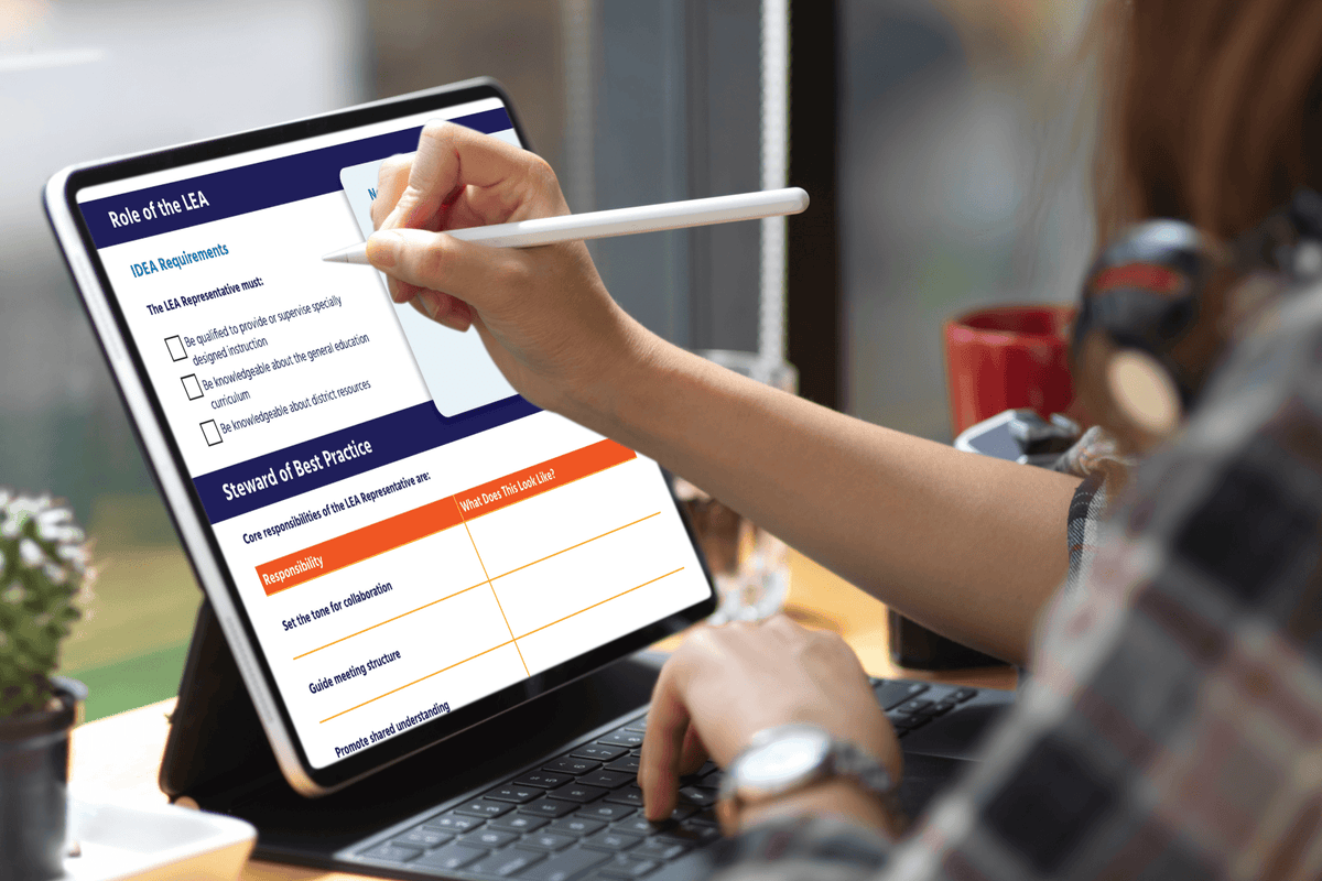 Professional reviewing a “Role of the EA” checklist on a tablet with a stylus beside a laptop, suggesting focused workplace planning.