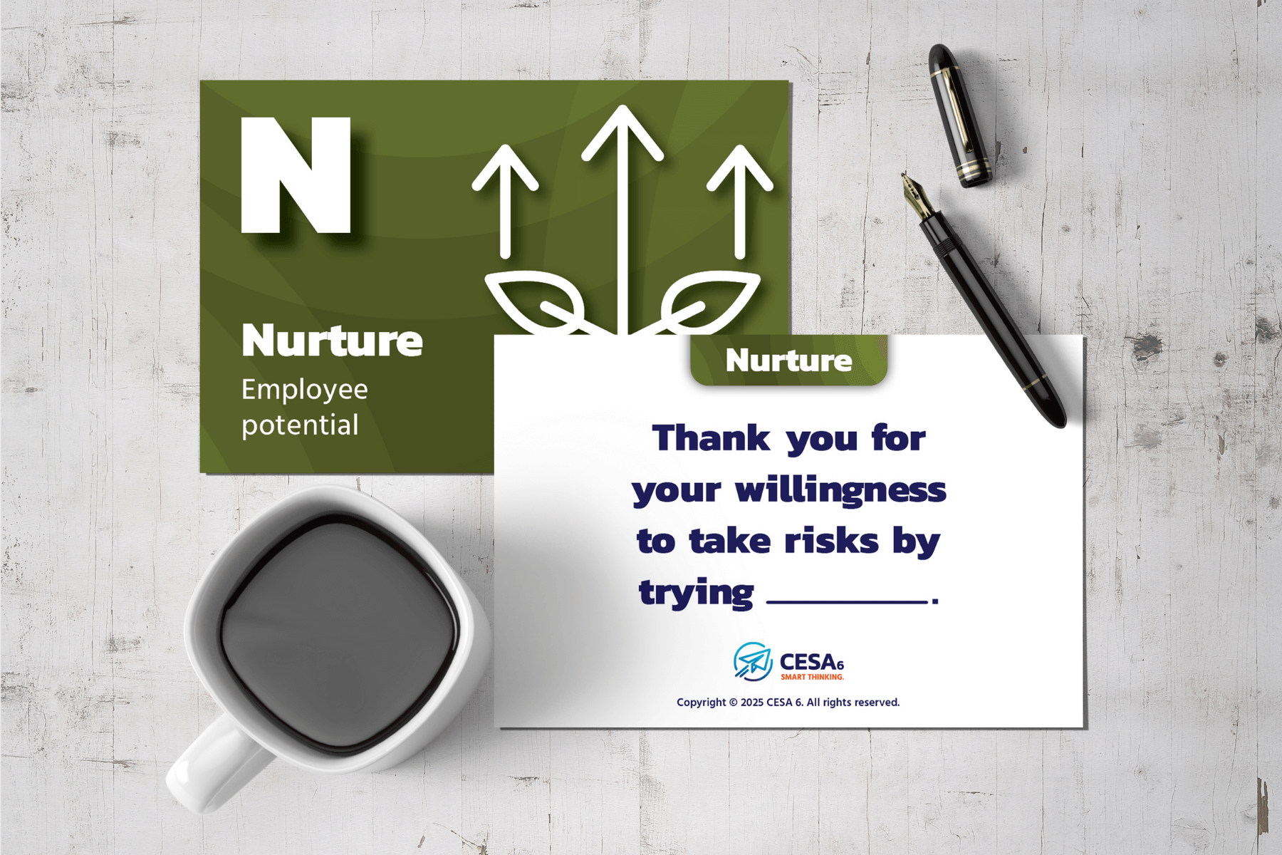A green card titled 'Nurture Employee Potential' shows leaf and arrow graphics. Nearby is a note thanking risk-taking, with a blank space, alongside a pen and a coffee cup on a wooden table.