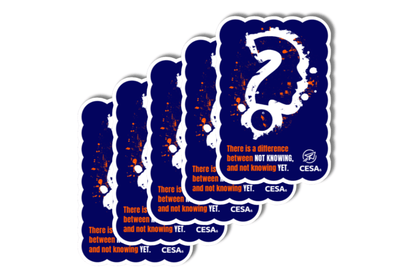 A stacked set of five identical stickers features a navy blue background with a splattered paint effect in orange and white. In the center is a silhouette of a head shaped like a question mark. Below it, the text reads: “There is a difference between NOT KNOWING, and not knowing YET.” The CESA 6 logo is in the bottom right corner. The stickers have a scalloped edge and are slightly offset to show the full set.