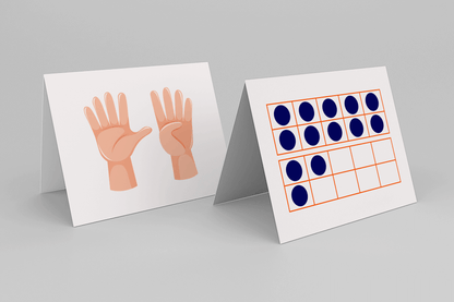 Two white, tent-style math cards are displayed upright on a light gray surface. The card on the left shows two illustrated hands with fingers spread—one with all five fingers raised and the other with four—representing the number nine. The card on the right features a twenty-frame outlined in orange, with seventeen blue dots filling the boxes, used to visually represent quantity.