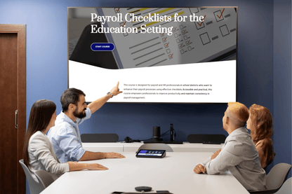 A team sits in a conference room reviewing a screen displaying "Payroll Checklists for the Education Setting." The presenter points to the board, indicating focus and collaboration.