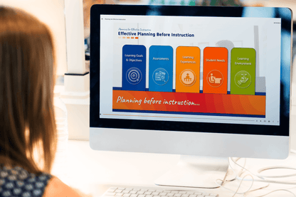 A woman views a computer screen displaying a presentation on "Effective Planning Before Instruction" with colorful icons for different teaching focus areas.