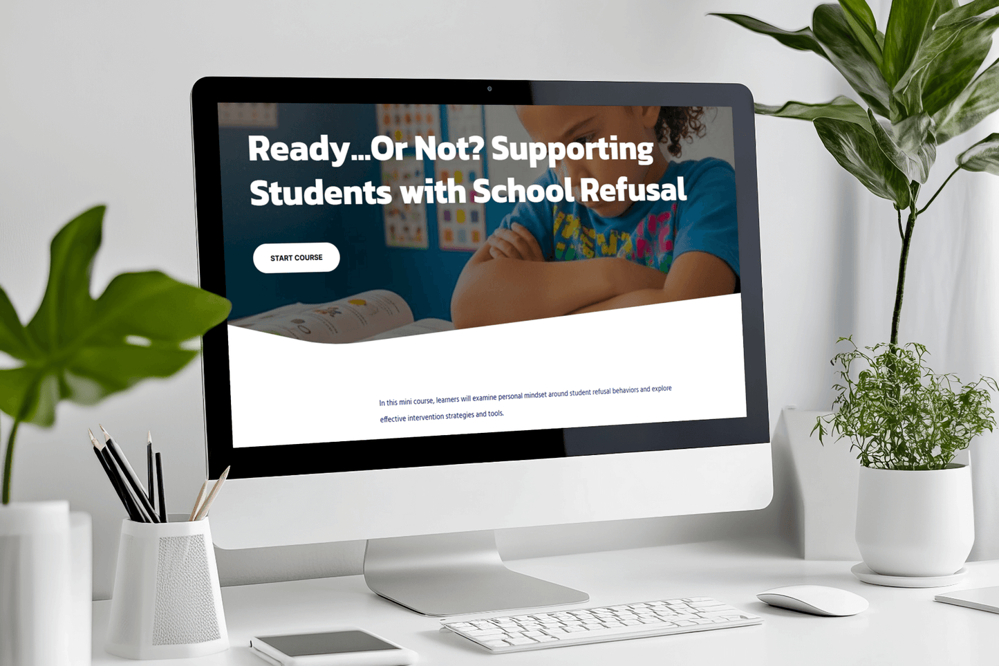 A computer screen displays a course titled "Ready...Or Not? Supporting Students with School Refusal." A plant, pencils, and notepad are on the white desk.