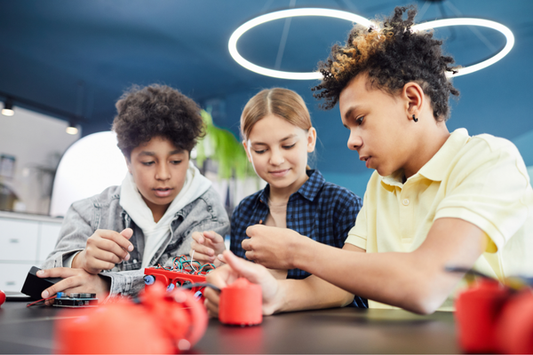 Inclusive STEAM learning environment with diverse students collaborating on a hands-on robotics project.