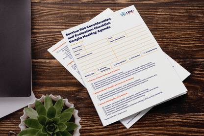 Two printed documents titled "Section 504 Consideration and Evaluation Checklist" lie on a wooden table. A succulent and a closed laptop are nearby, creating an organized and professional atmosphere.