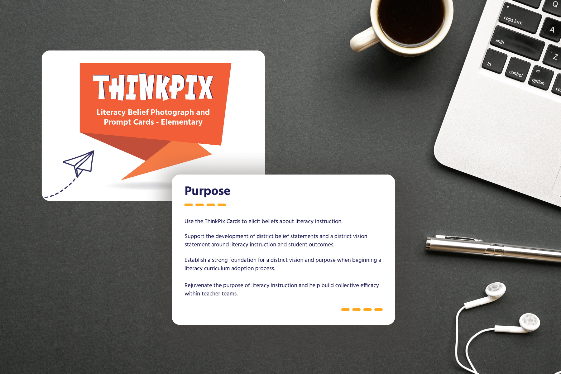 Desktop scene featuring ThinkPix cards about literacy instruction on a dark surface. Nearby are a laptop, a pen, earphones, and a cup of coffee.