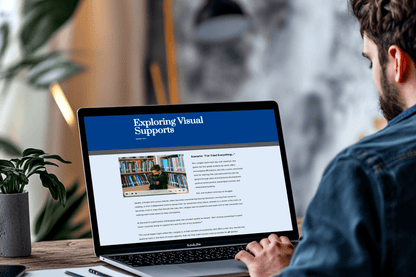 A person is using a laptop displaying a webpage titled "Exploring Visual Supports." The screen shows text and an image with audio of the scenario of a student by bookshelves. 