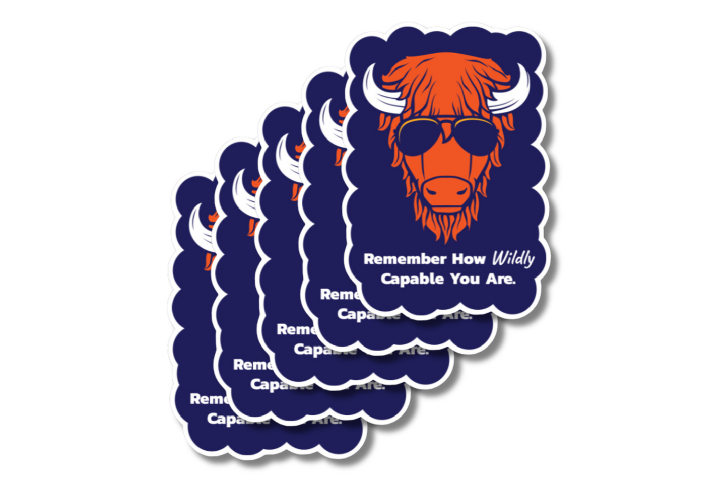 A stack of scalloped-edge stickers featuring an illustrated orange buffalo wearing black sunglasses against a dark blue background. The text below reads, 'Remember How Wildly Capable You Are.' in white and italicized font.